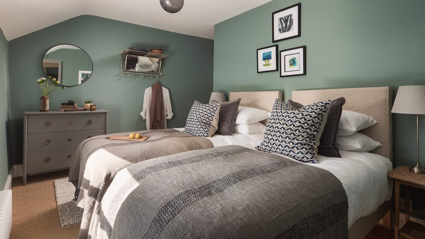 This pretty bedroom has a zip-and-link bed, meaning it can be set up as twins or or a super king double