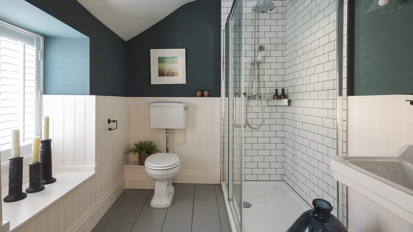 The shower room located next to the second and third bedroom