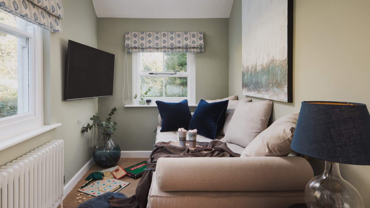 Across the landing from the master bedroom you’ll find a snug complete with daybed, Smart TV and PS4 