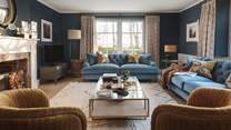The dual-aspect windows offer plenty of light, whilst the velvet sofas and chairs create ample seating