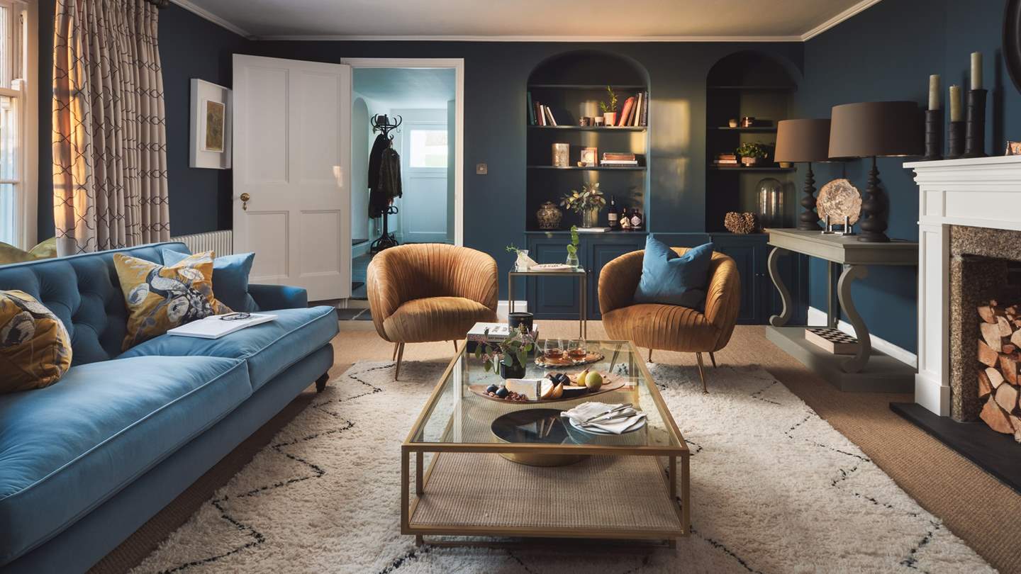 The jewel-like blues and golds evoke the charm of the Georgian period