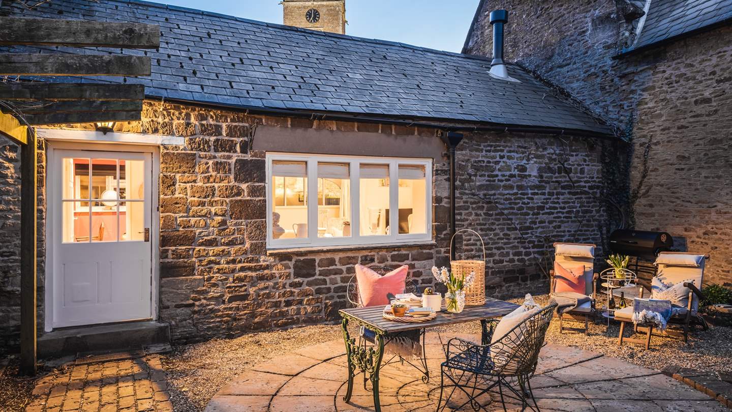 The enclosed courtyard is the perfect setting for meals alfresco, whether it's for breakfast or supper