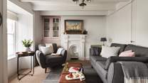 There's plenty of space to sprawl out in the sitting room - we just love the unique coffee table