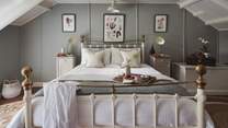 The king-size brass bed, made for long lie-ins and breakfast in bed