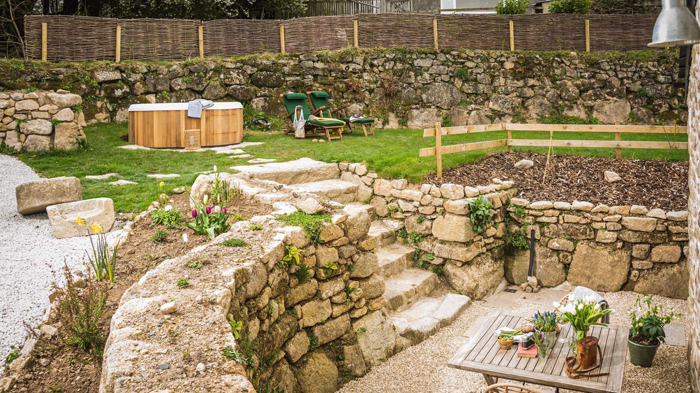 Set on two levels, the upper terrace is home to the hot tub