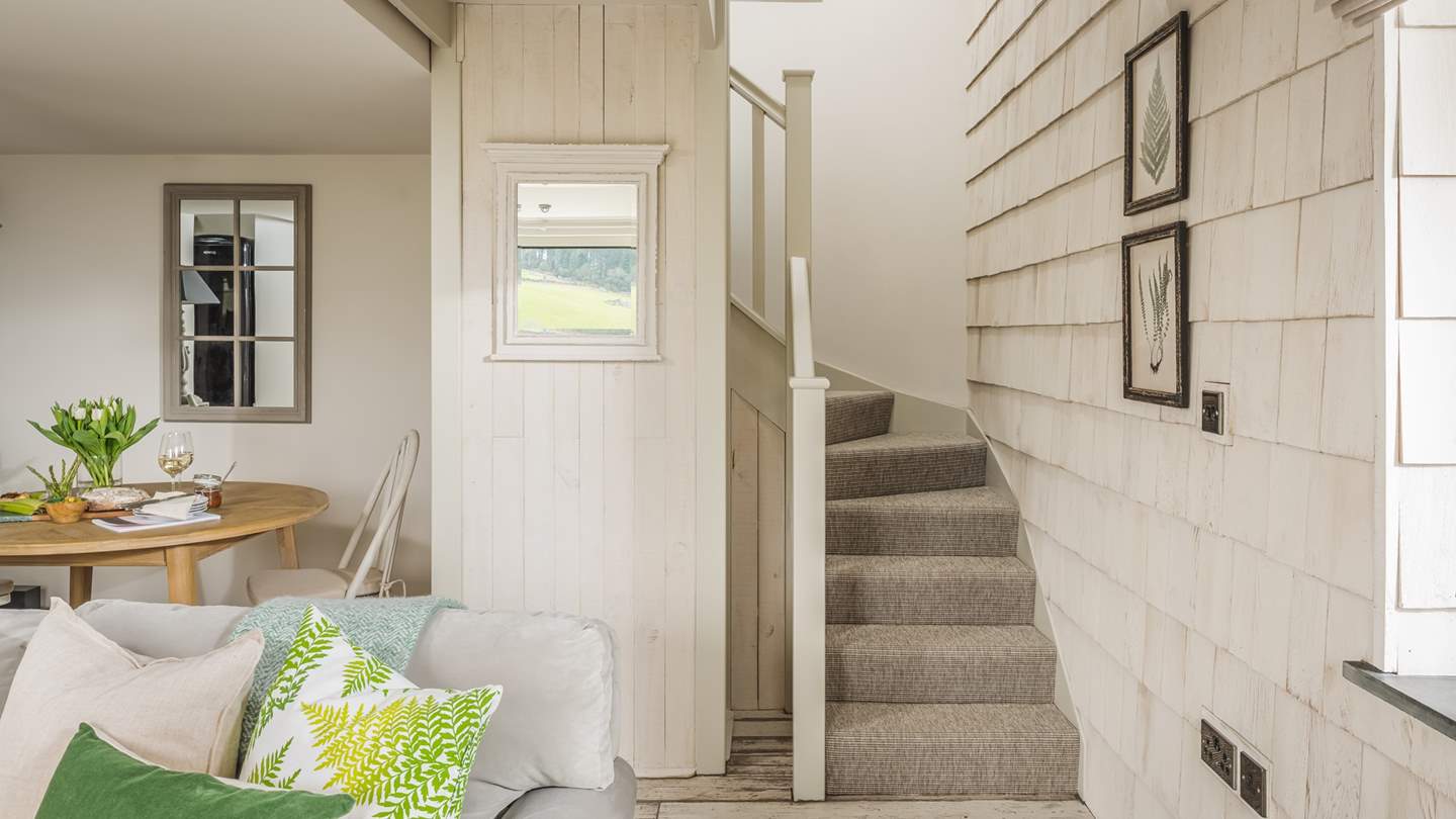 Take the stairs up to the bedroom and bathroom...
