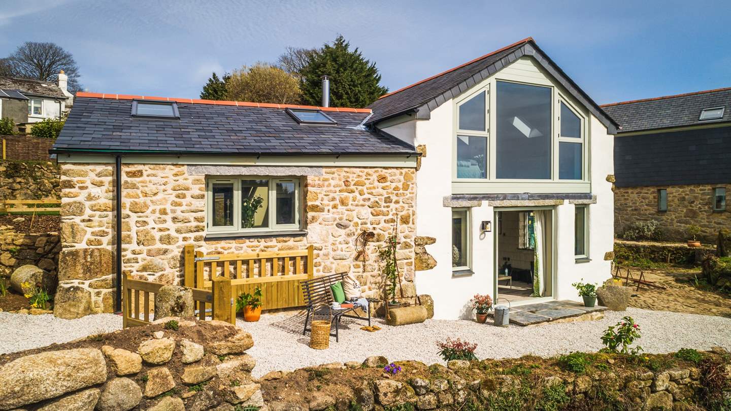 The sun-soaked patio is a wonderful spot to laze