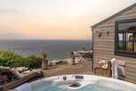 Uncover the dreamiest hot tub moments looking out over the horizon...