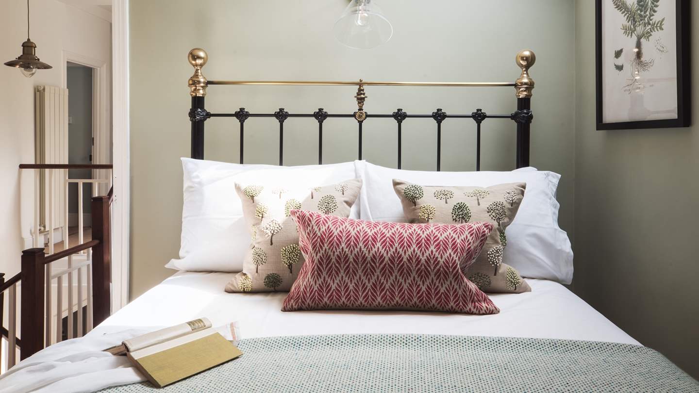 A lovely spot for a long lie in, bed knobs and broomsticks style!