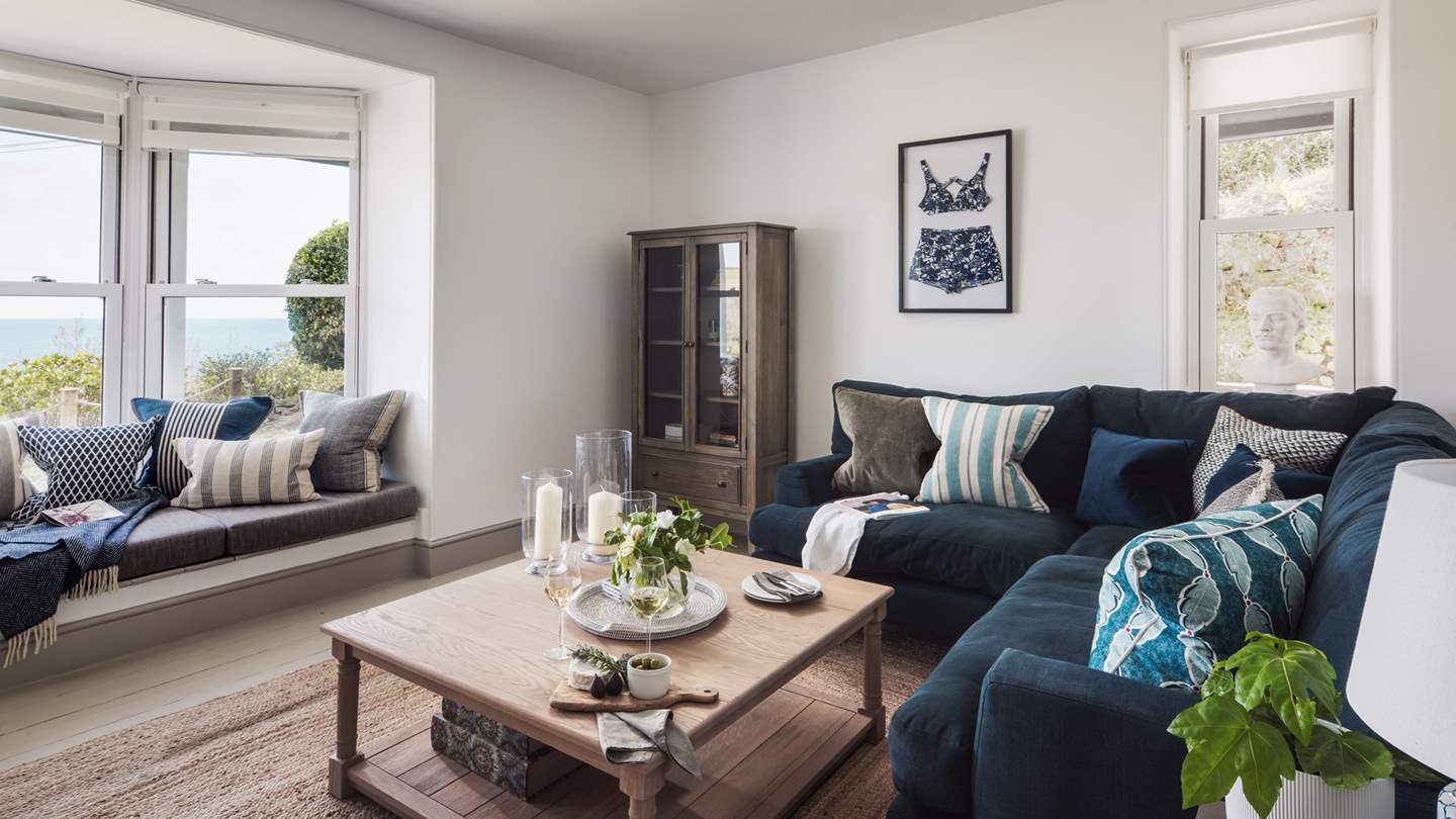 The 'Summer' room has extraordinary views and a plumptuous navy sofa to sprawl on