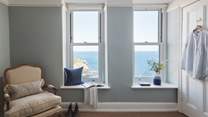 This wonderful bedrooms has stunning sea views from the comfort of the bed and an en suite shower room