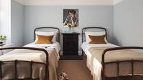 The adorable twin bedroom is perfect for little ones or friends sharing