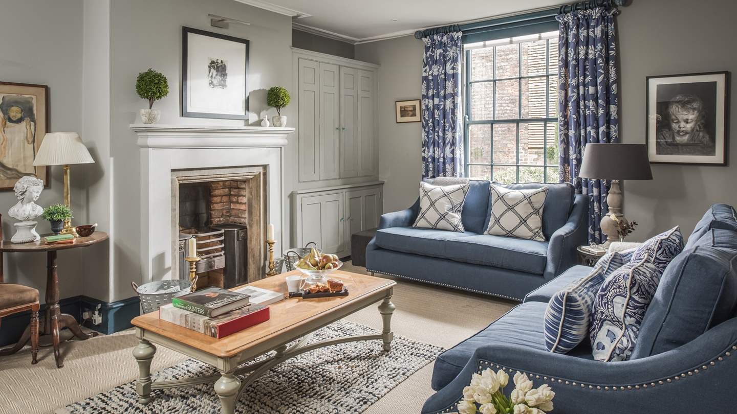 The pretty sitting room, with double sofas, is the perfect place to escape to at the end of the day