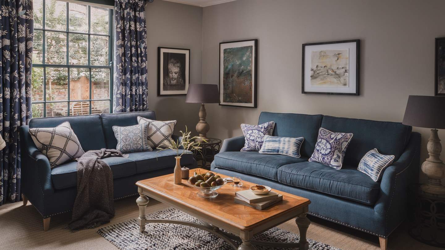 Stretch out in style with a choice of two plump, blue sofas 
