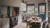 From original flagstone flooring to sleek, shaker cabinets topped with elegant Carrara marble worktops, the traditional kitchen promises a calming space for creating culinary magic