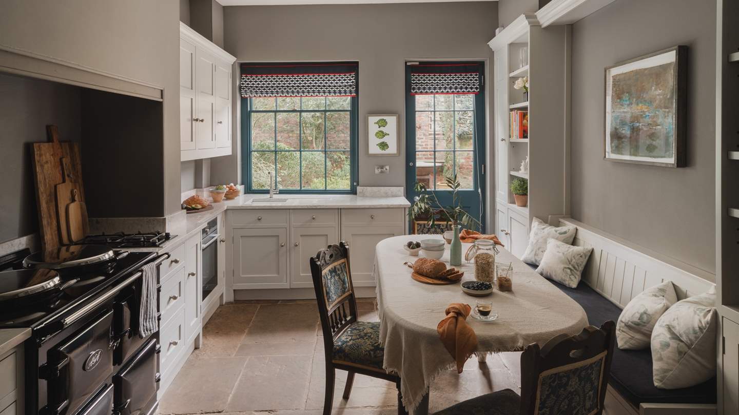 The gorgeous black aga resides in a former fireplace nook - a striking feature and cosy addition in the cooler months
