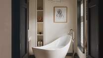 The calming en suite is a spellbinding setting for self-care moments