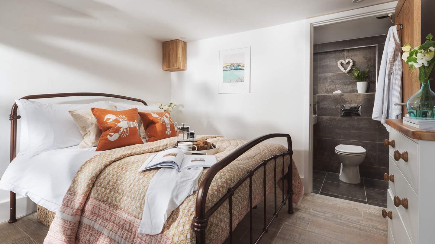 The bedroom has a handy en suite shower room