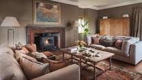 Super cosy and oh-so-luxurious, the sitting room is the perfect place to withdraw to at the end of the day