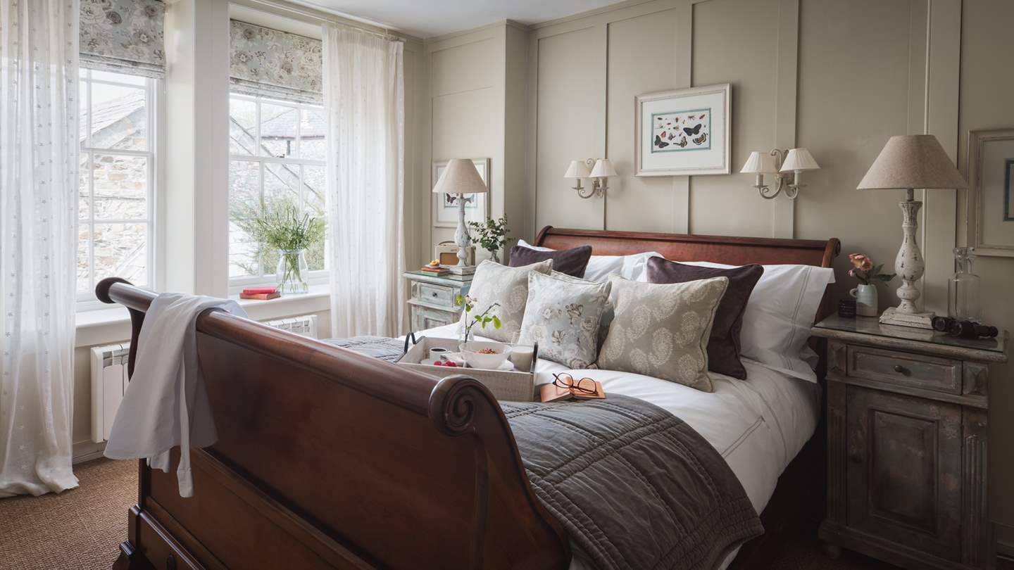 The stunning master bedroom with French bateau king-sized bed