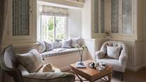 The upstairs sitting room is abundant with natural light...