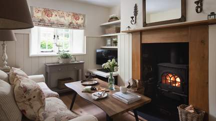 A dream in every season, the cosy downstairs sitting room is the perfect space to relax 
