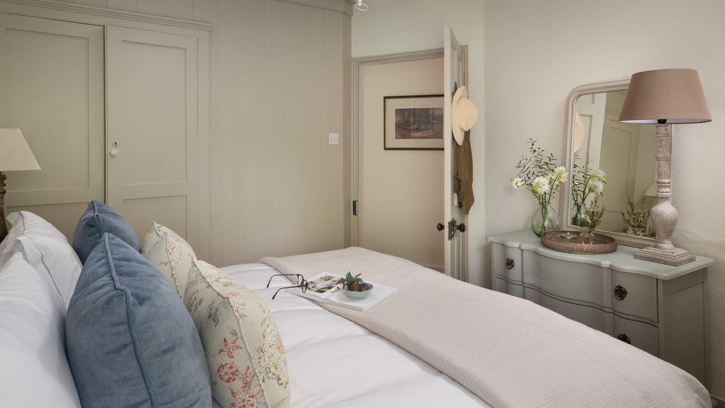 The pretty second bedroom has a built in wardrobe offering plenty of storage space 