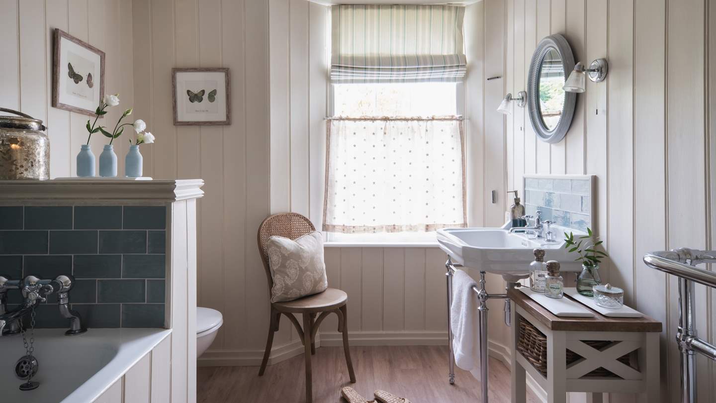 The family bathroom has a wonderful bath for long, bubbly soaks