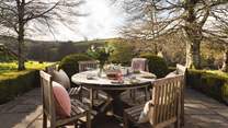 The sunny terrace is the perfect spot for meals, overlooking the stunning countryside
