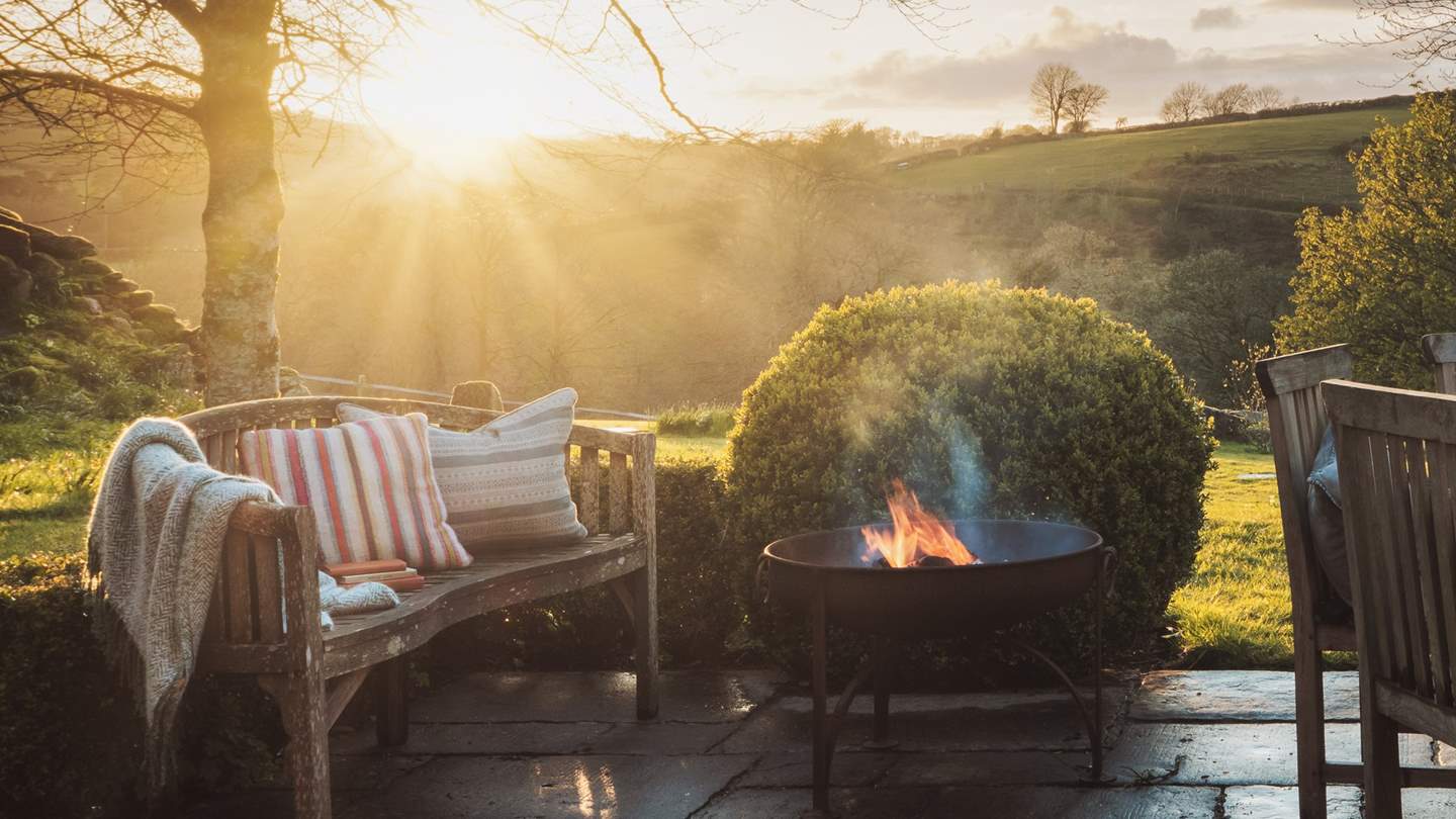 Curl up by the fire pit as the sun sets and the stars rise above