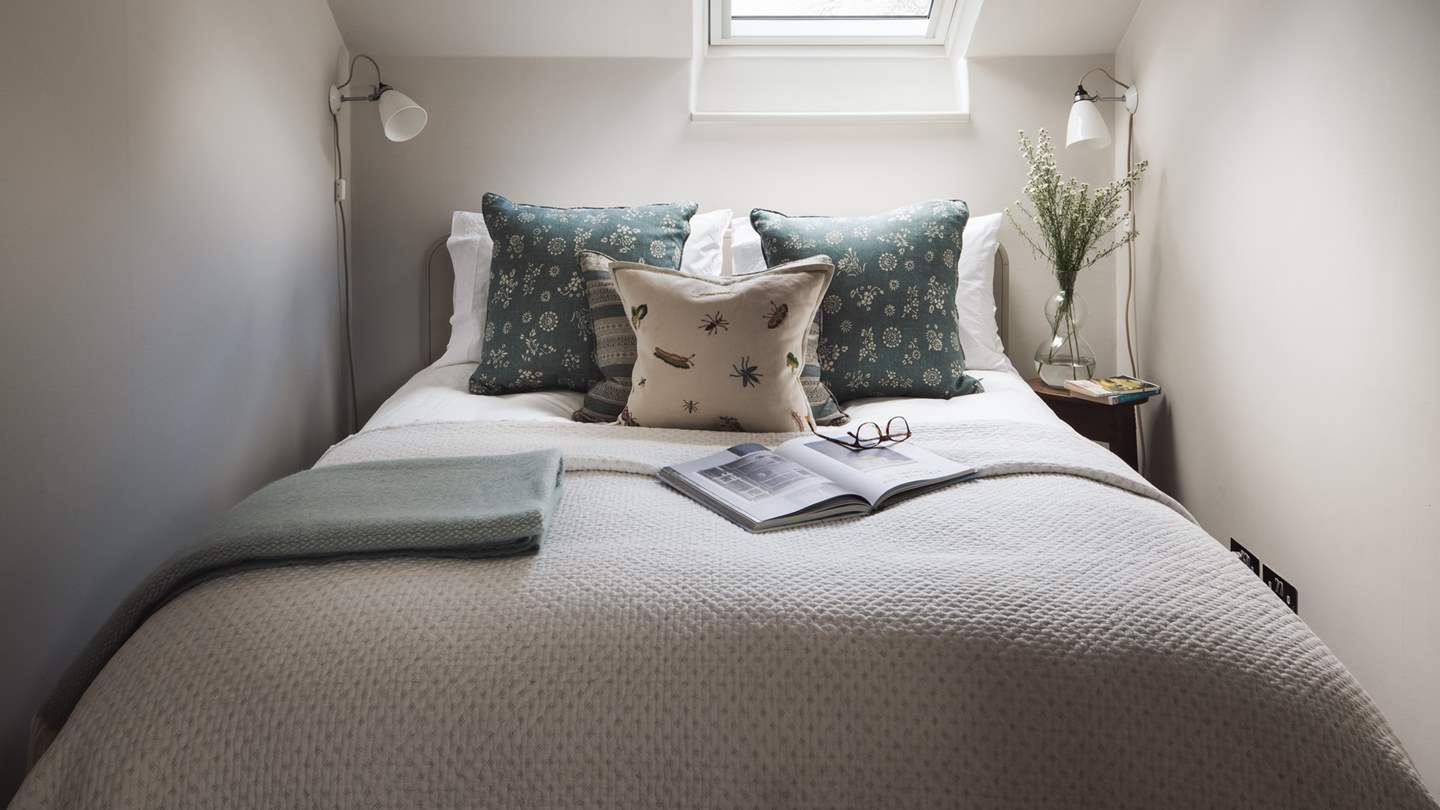 The second bedroom is a cosy double with Velux window and chest of drawers