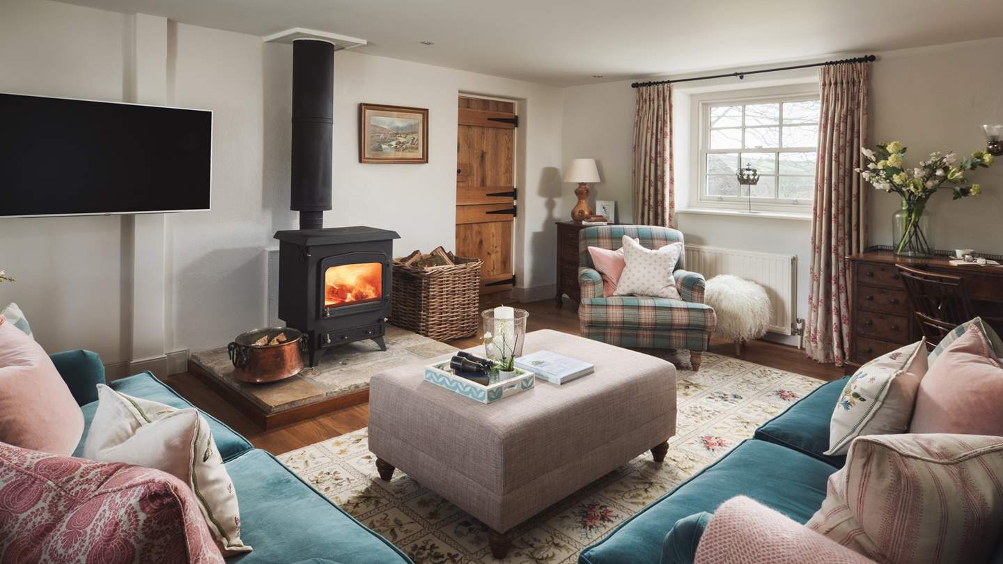 The oh-co-cosy sitting room awaits, resplendent with wood burner