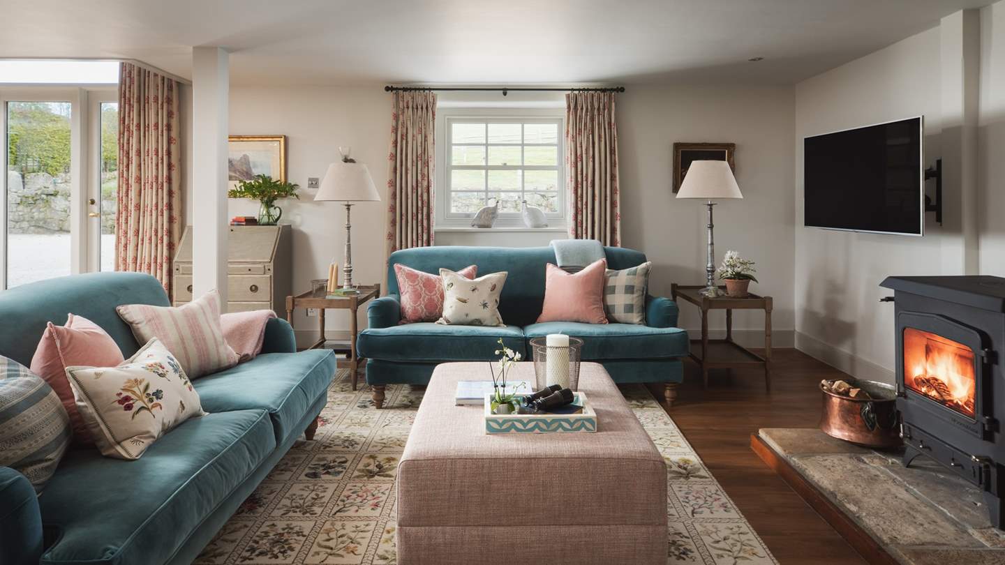 The oh-co-cosy sitting room awaits, resplendent with wood burner