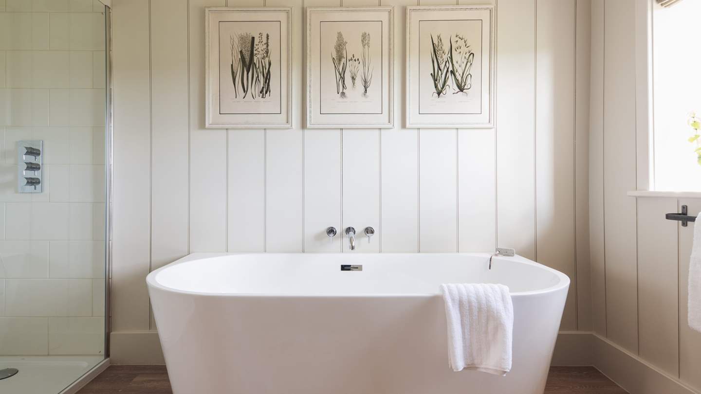 The family bathroom with bath and shower