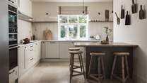 The country-style yet oh-so-modern kitchen is fully equipped with everything you need