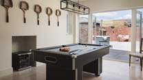 The fabulous games room complete with pool table, love seat and wine chiller