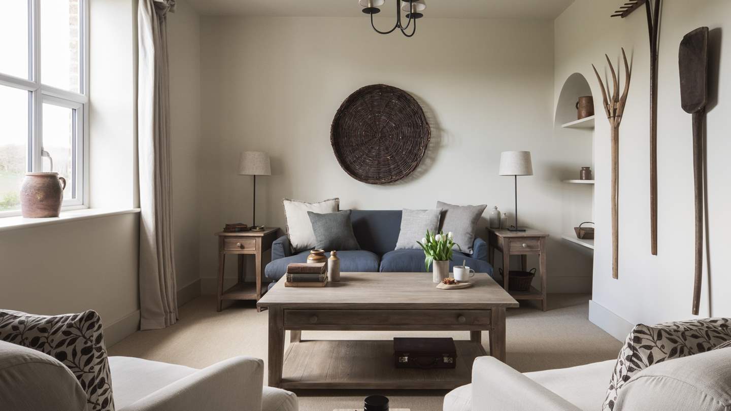 The spacious sitting room with seating aplenty. We love the vintage tools on the wall