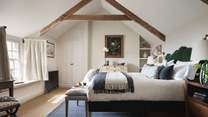The master bedroom, with vaulted ceiling, sea views and pretty window seat - bliss!