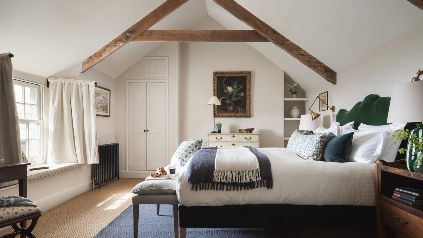 The master bedroom, with vaulted ceiling, sea views and pretty window seat - bliss!