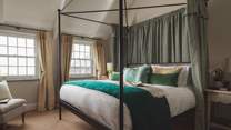 The second bedroom, with stunning super king sized four poster bed