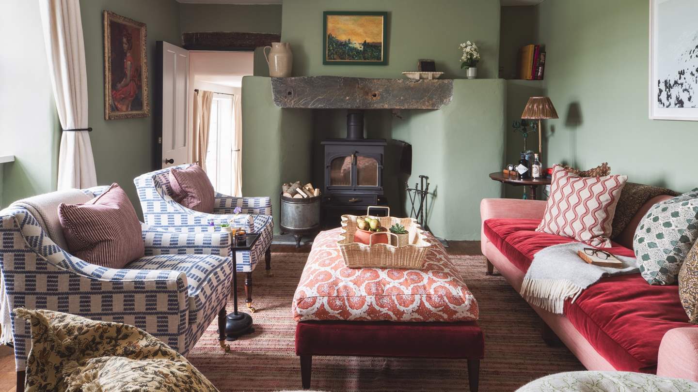 The stunning sitting room with cosy wood burner is just a delight to retire to at the end of a day out exploring