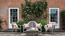 The fabulous, rose covered terrace is a wonderful spot for afternoon tea