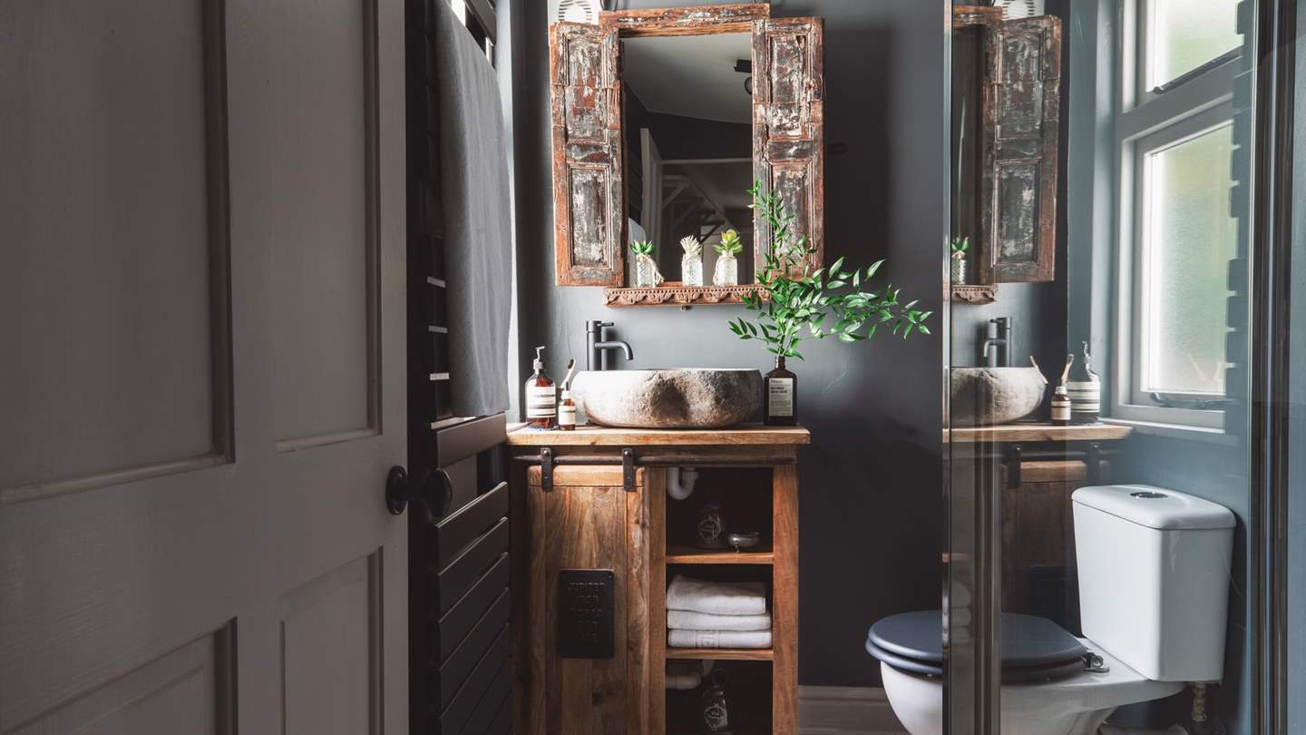 The pretty shower room, shared by the two bedrooms in the main house