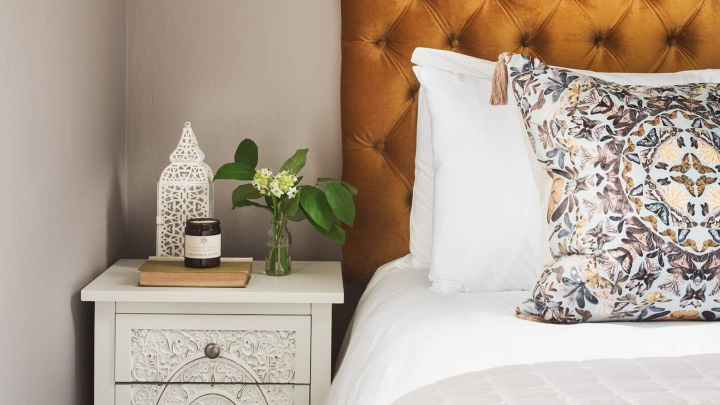 We're in love with the gold velvet headboard...just bliss!