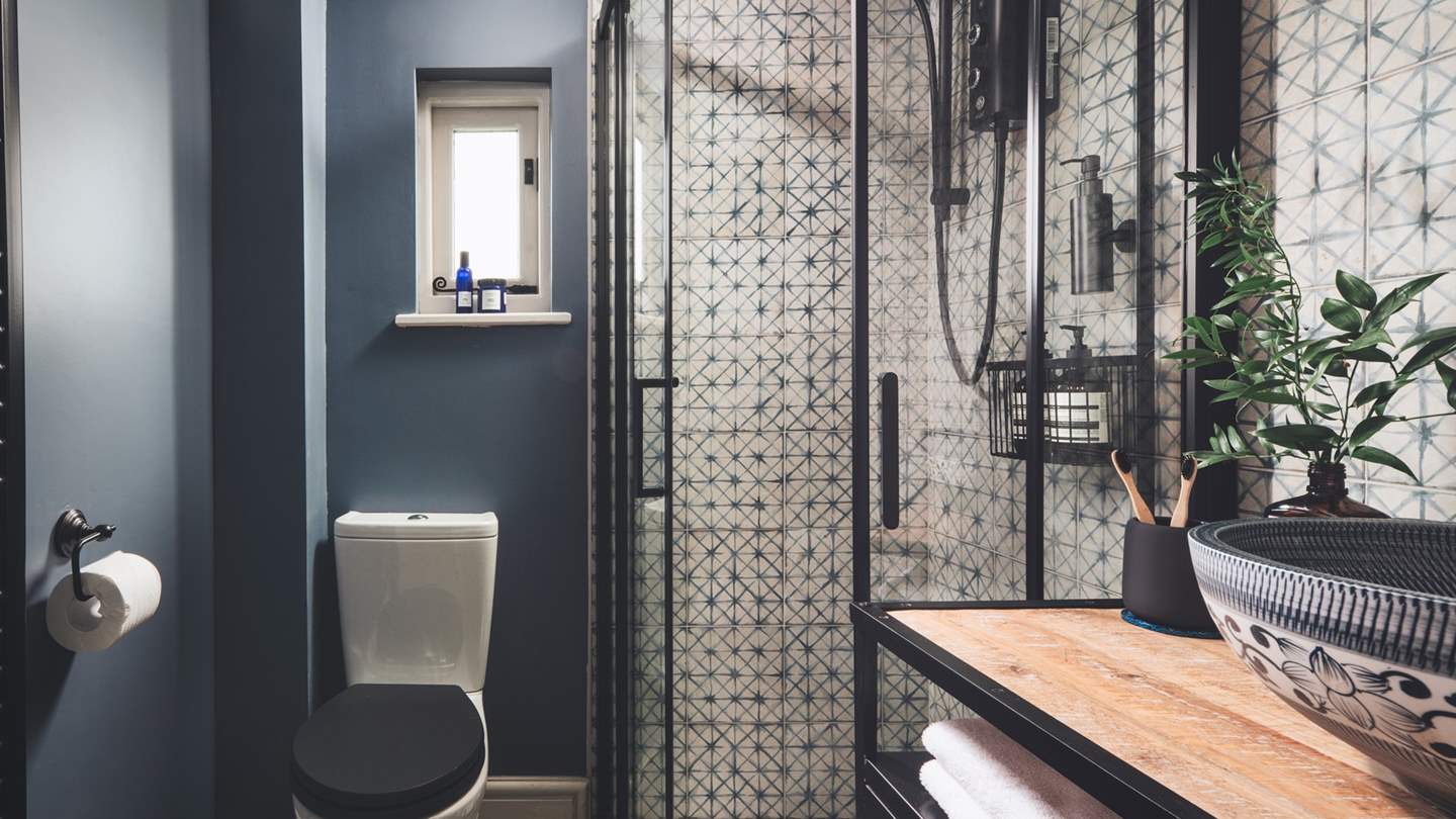 This bedroom has a pretty en suite shower room 