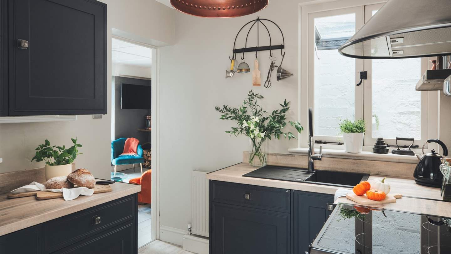 The kitchen situated next to the sitting room is a chefs dream