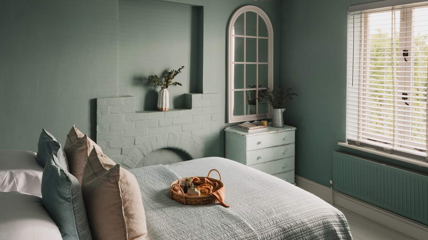 With the original feature fireplace and a sumptuous double bed, it's the perfect space to retreat to at the end of a busy day exploring