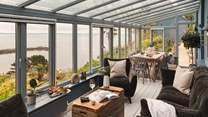 Inside, stunning interiors await, with two exquisite bedrooms in the main house and a further bedroom with en suite bathroom in the former artist's studio with jaw-dropping sea views
