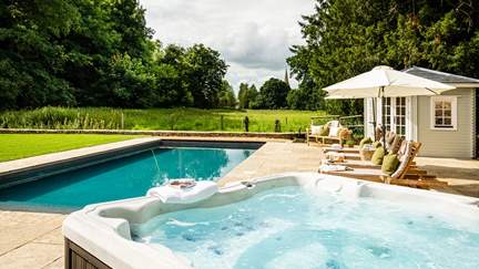 Both a heated pool and a bubbling hot tub awaits...