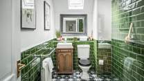 The fabulous family shower room - we just love the green tiles!